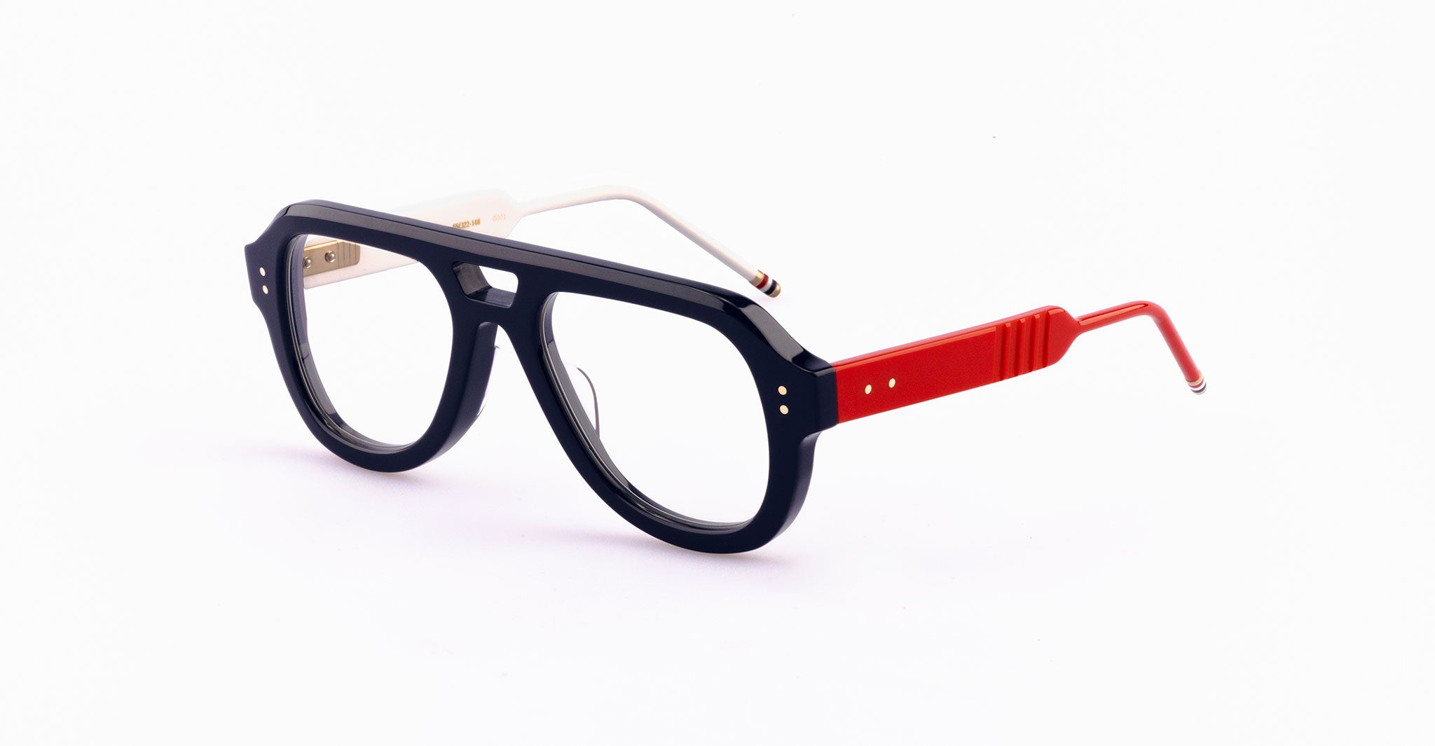 Thom Browne 925 eyeglasses, black thick frames, white left temple, red right temple, front view.