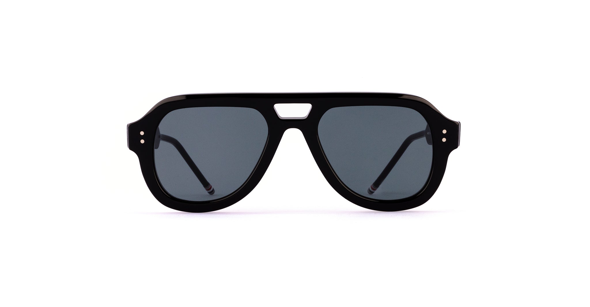 The Thom Browne 923 sunglasses in Black showcase an aviator-style design with dark tinted lenses and a solid frame, displayed against a white background.