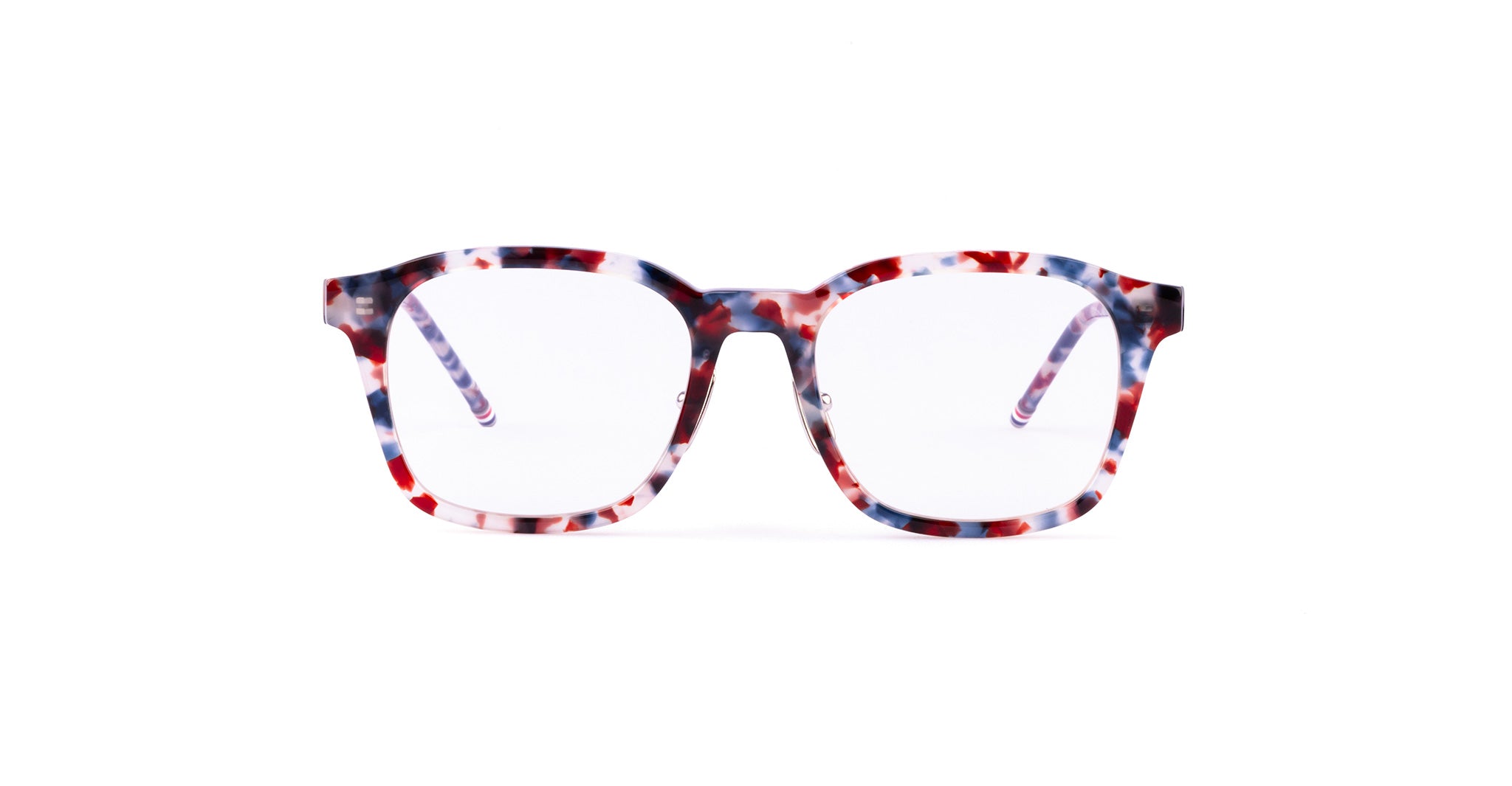 A pair of square Thom Browne eyeglasses with a multicolored frame featuring a mix of red, blue, and white patterns.