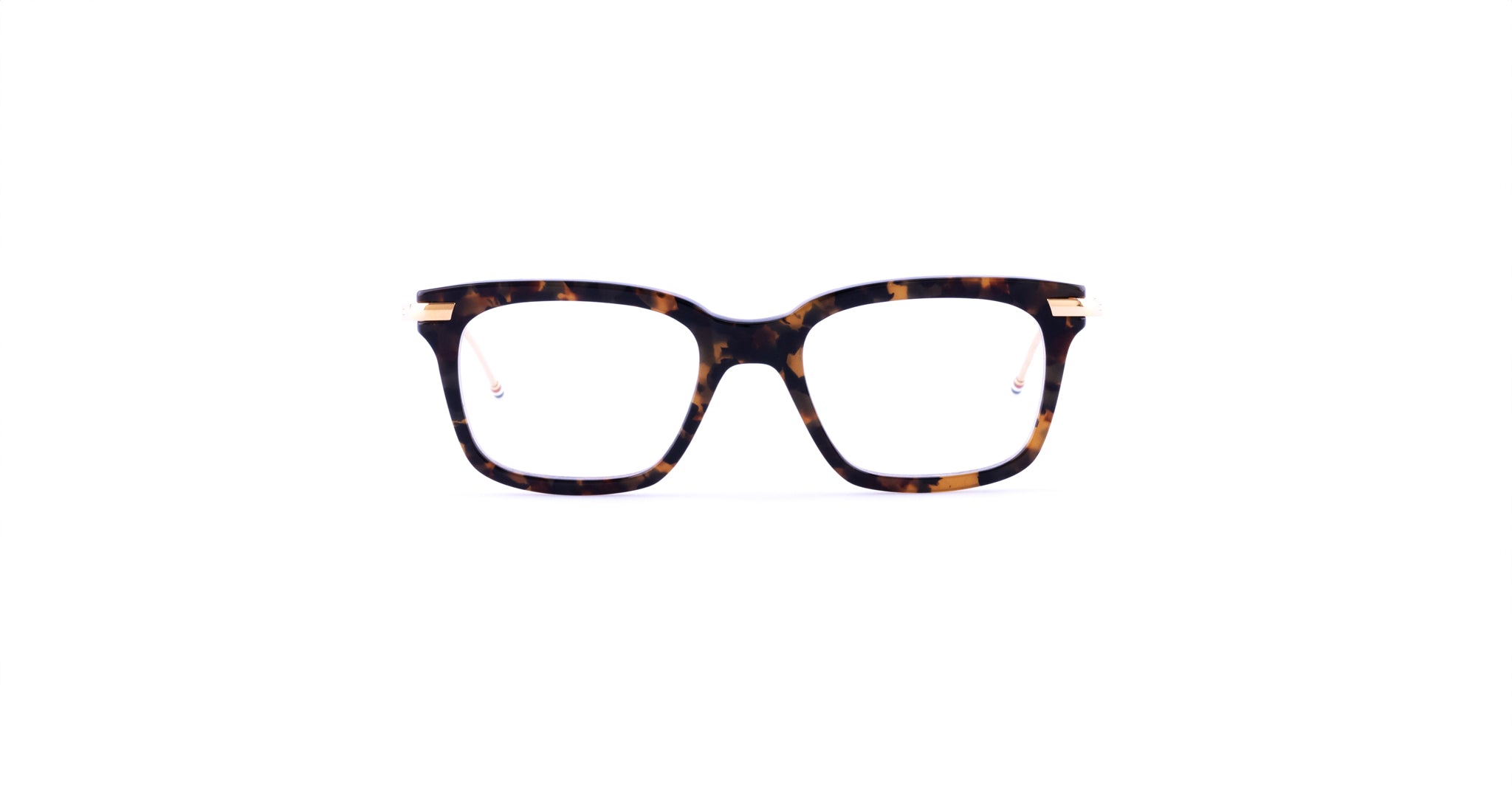 Thom Browne 701 tortoiseshell rectangular eyeglasses with gold accents, front view.