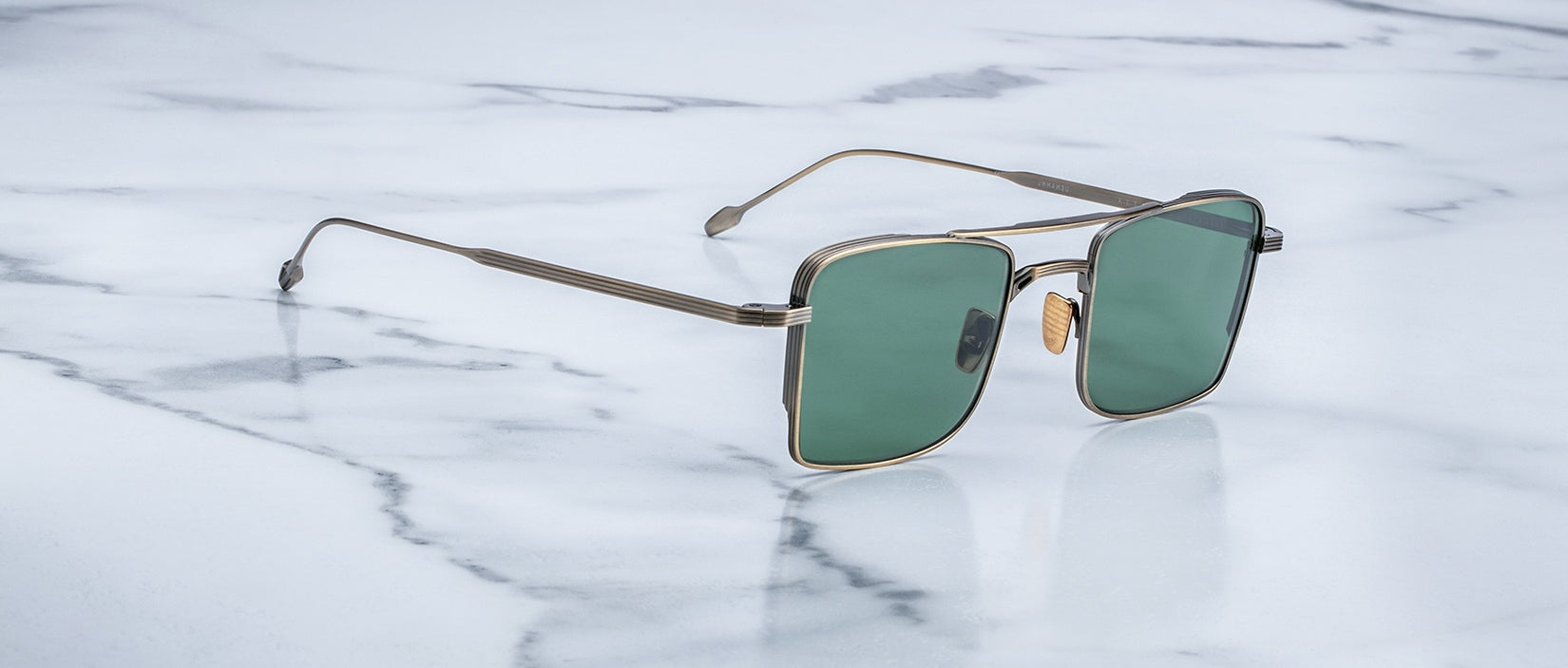 Angled view of the Jacques Marie Mage Altamont style sunglasses in Gold Antique