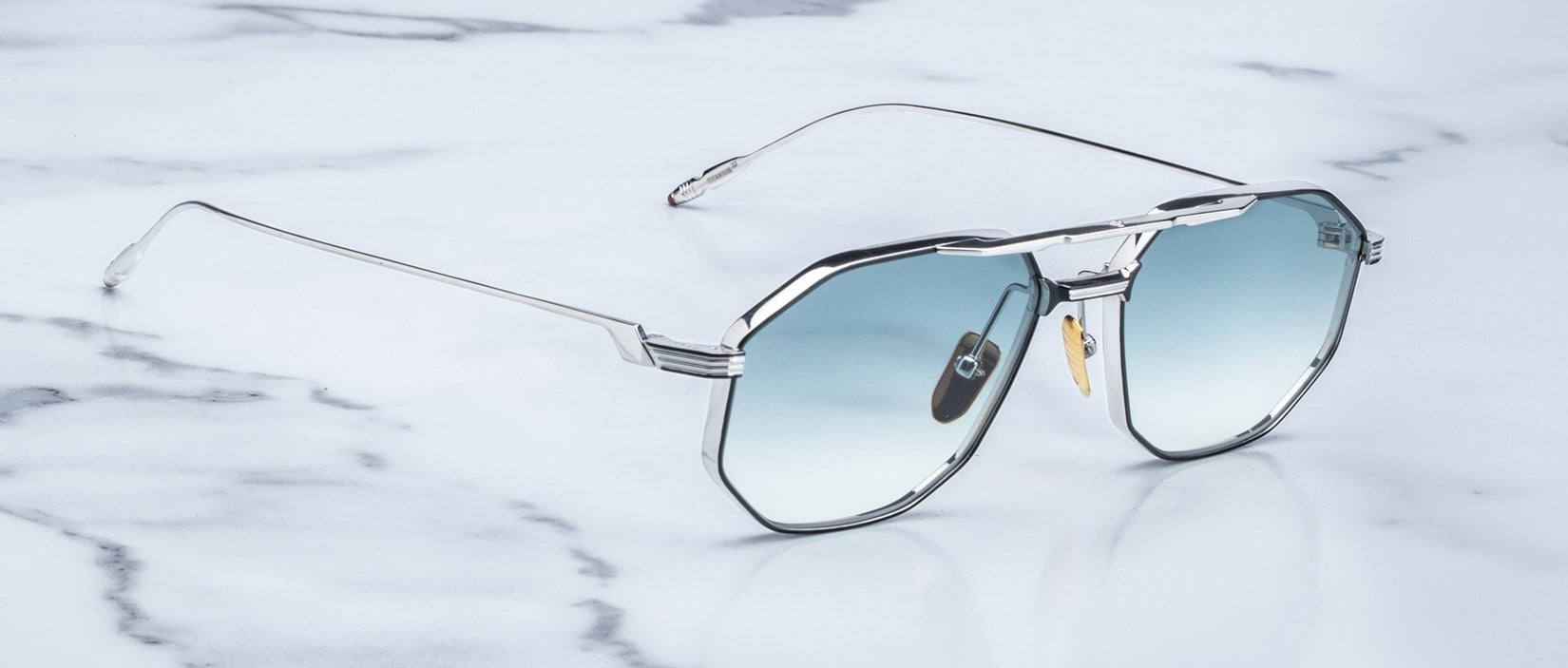 Angled view of the Jacques Marie Mage Bandit style sunglasses in colorway Arcade