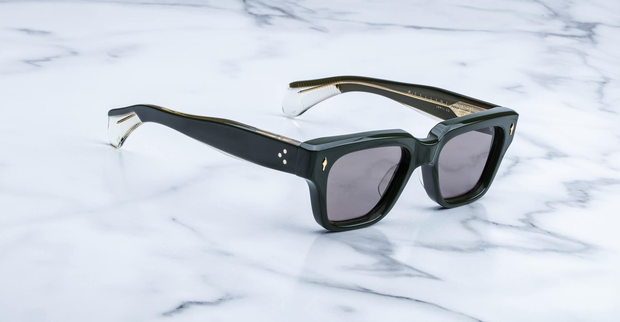 Jacques Marie Mage Fellini sunglasses shown from above, featuring the brand and model on a flat surface.