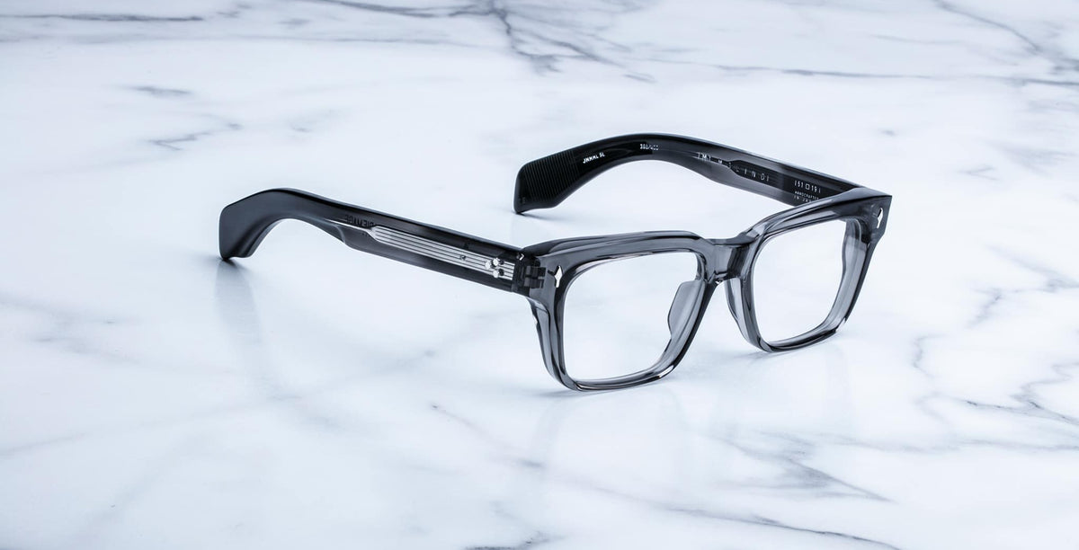Jacques Marie Mage Molino eyeglasses, rectangular, thick clear acetate rims, shown from front angle.