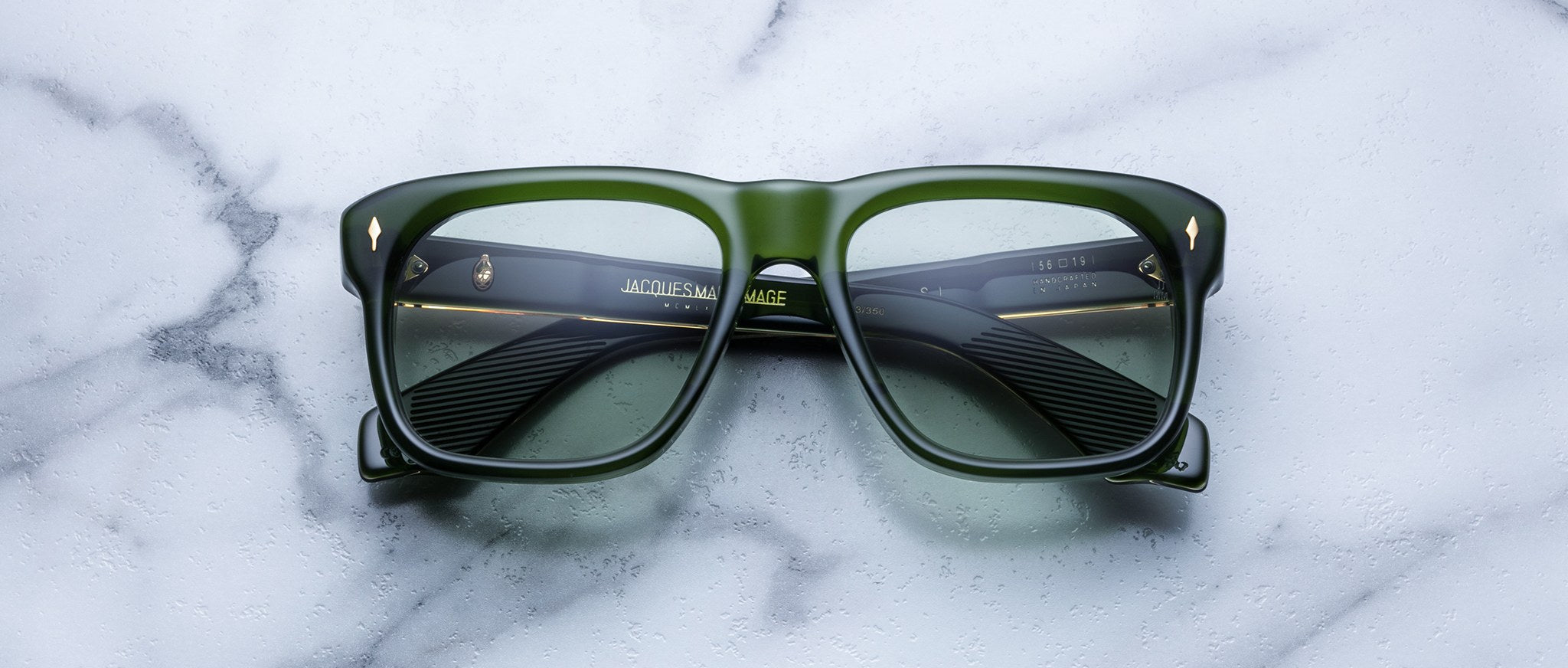 Jacques Marie Mage Yves green square-framed eyeglasses with tinted lenses, top view.