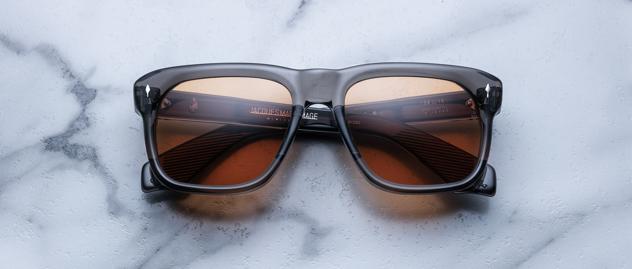 Jacques Marie Mage Yves square sunglasses with brown lenses, top view showing front and temples.