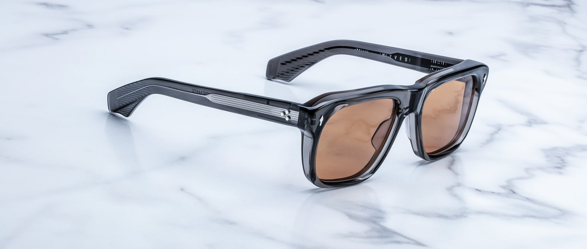 Jacques Marie Mage Yves black rectangular sunglasses with UV-protection brown lenses, top view.