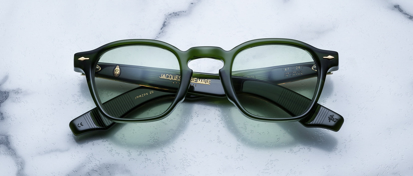 Jacques Marie Mage Zephirin 47 green-framed eyeglasses with clear lenses, viewed from above.