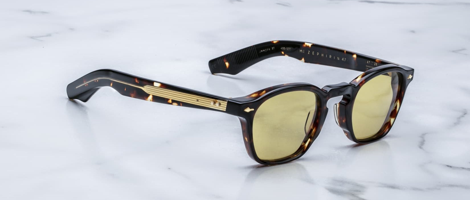 Jacques Marie Mage Zephirin 47 sunglasses, yellow lenses and gold accents, viewed from above.