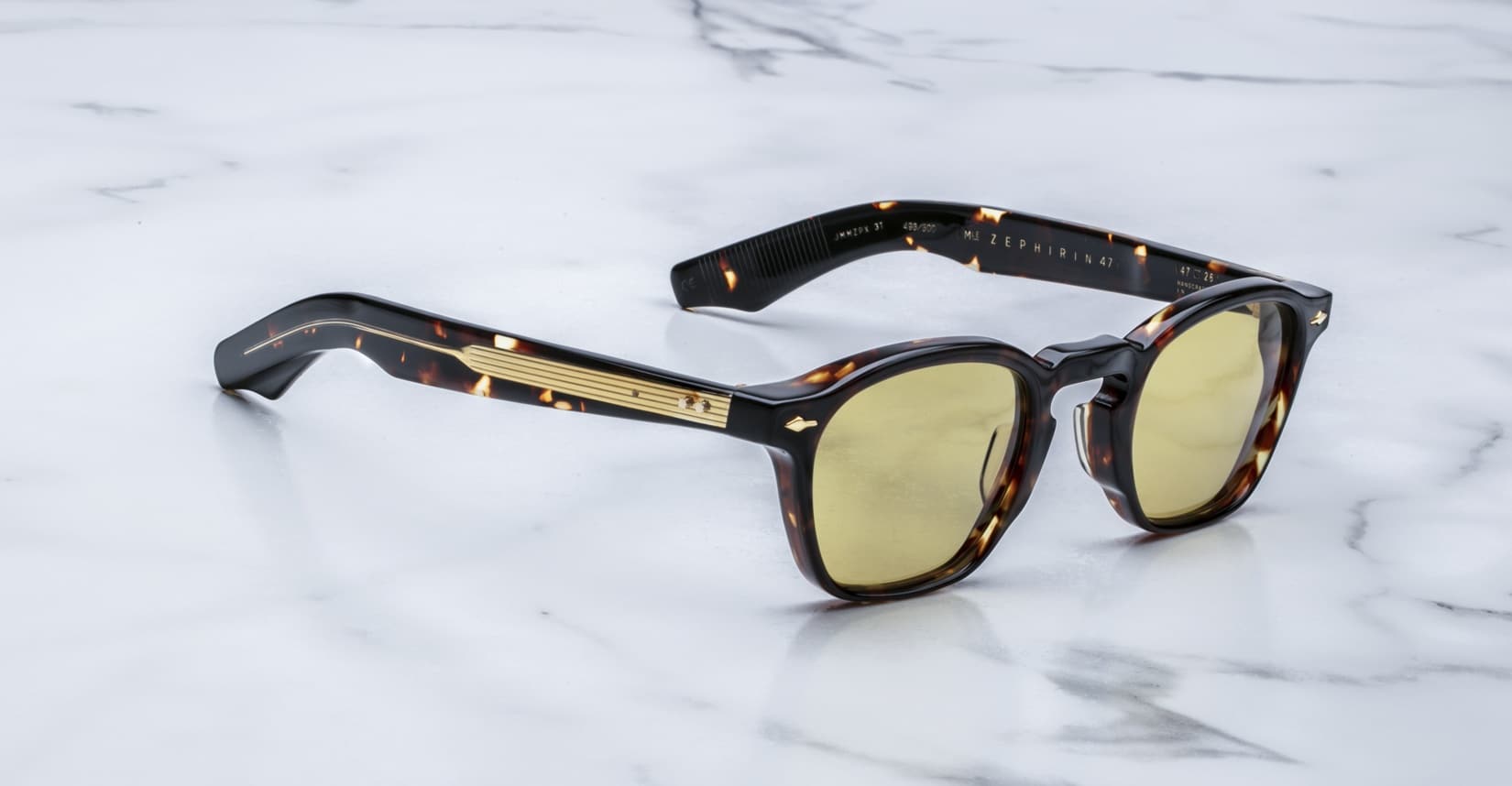 Jacques Marie Mage Zephirin 47 sunglasses, yellow lenses and gold accents, viewed from above.