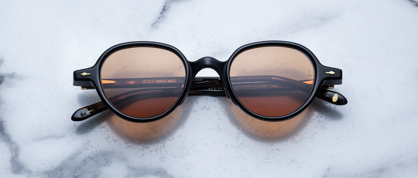 Jacques Marie Mage The Clark sunglasses, black frames, UV brown lenses, shown from above.