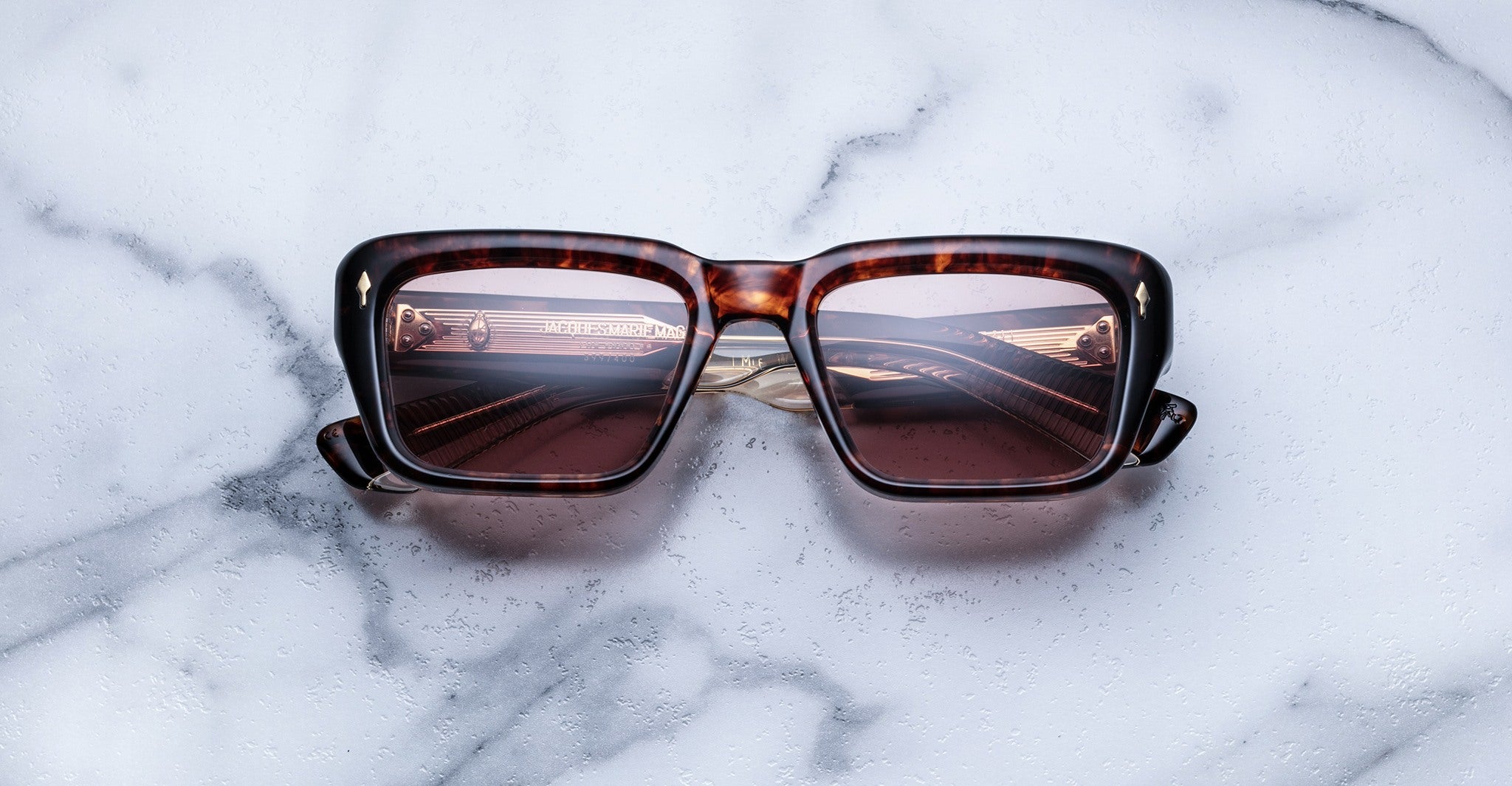 Jacques Marie Mage Walker square tortoiseshell sunglasses, front view with lenses reflecting a piano keyboard.