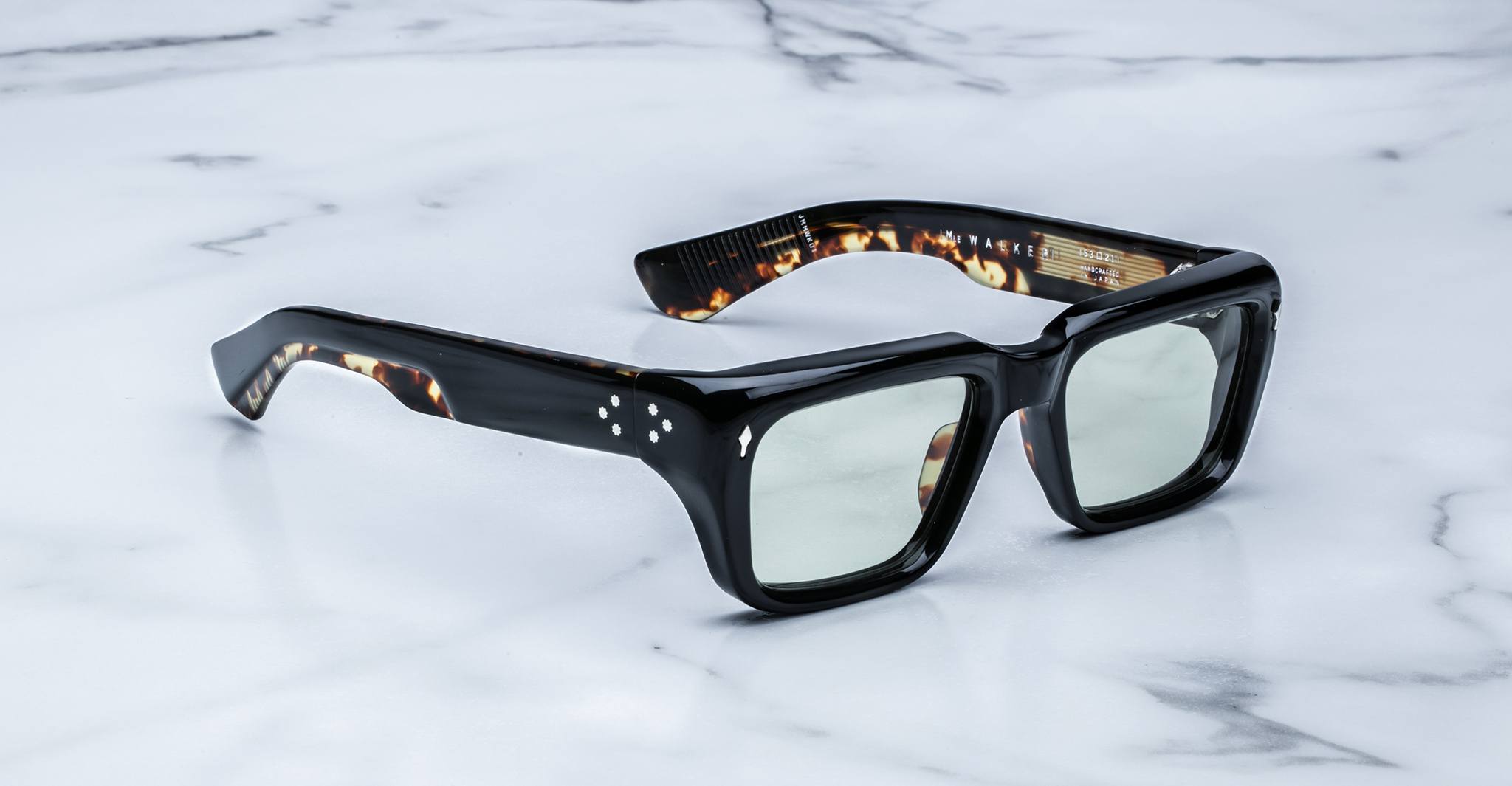 Jacques Marie Mage Walker black rectangular sunglasses with thick tortoiseshell arms, shown from the side.