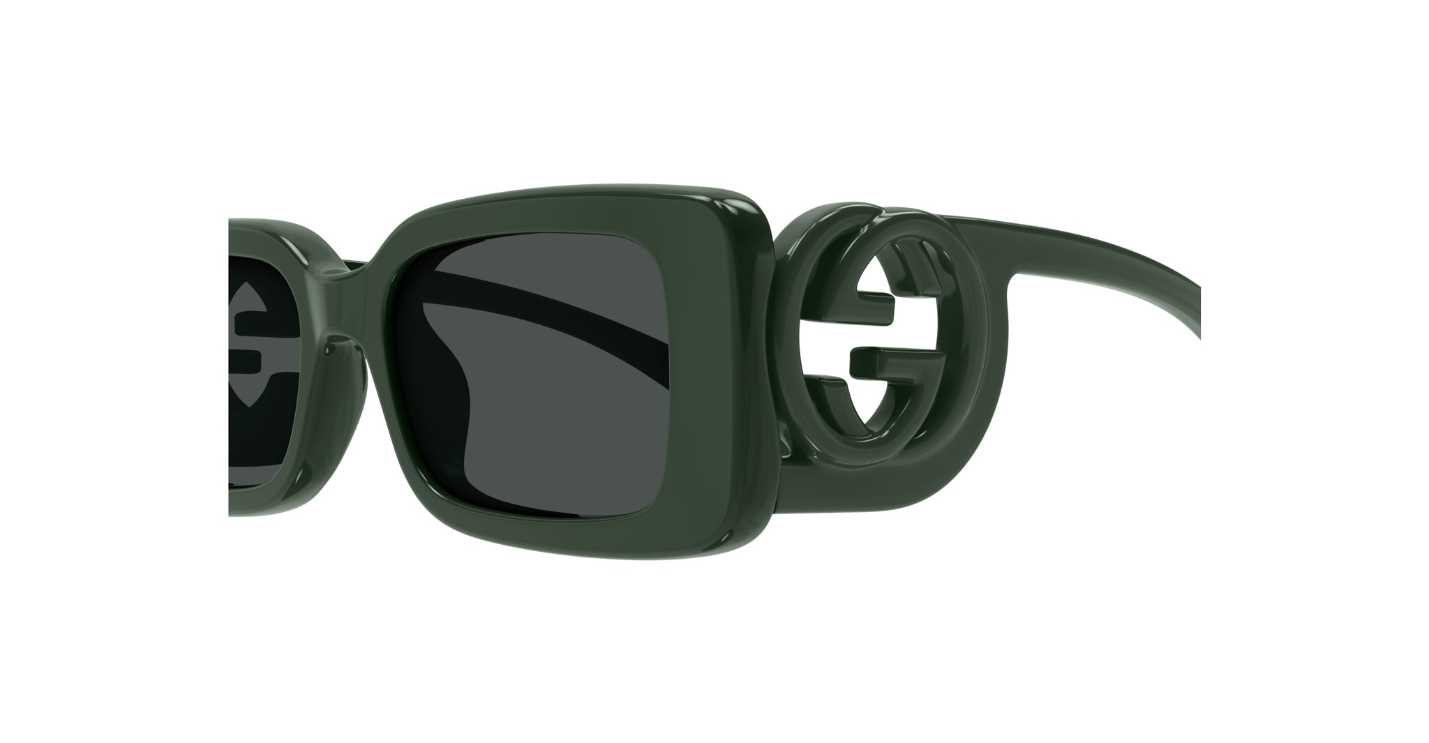 Close-up of Gucci GG1325S sunglasses, featuring dark green square acetate frames and prominent interlocking G logo on the temples.