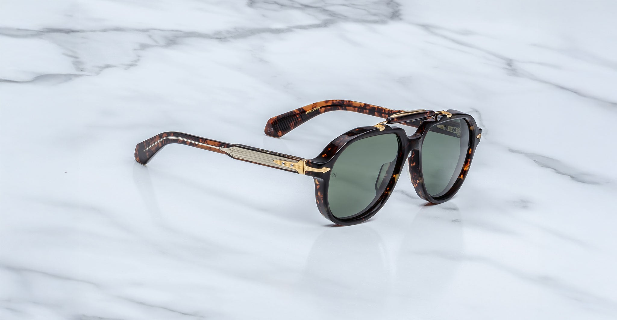 Jacques Marie Mage 1991 sunglasses, tortoiseshell frame, green polarized lenses, gold accents, front angle.