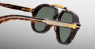 Jacques Marie Mage 1991 tortoiseshell sunglasses with gold accents and green polarized lenses, shown from the front angle.