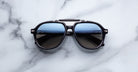 Jacques Marie Mage 1991 sunglasses with blue-tinted lenses, front view.