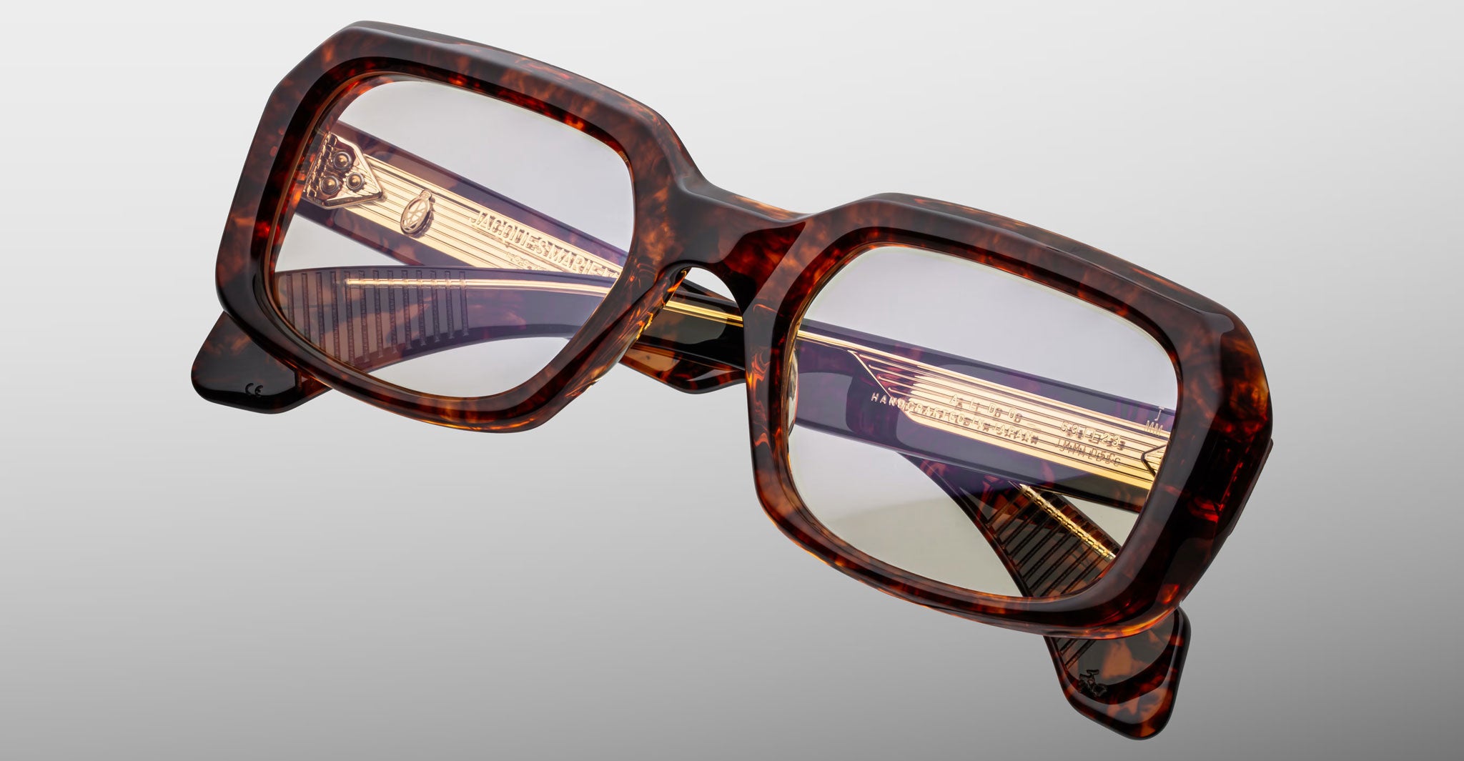 Jacques Marie Mage Aldo square tortoiseshell eyeglasses with gold temple accents, front-facing view.