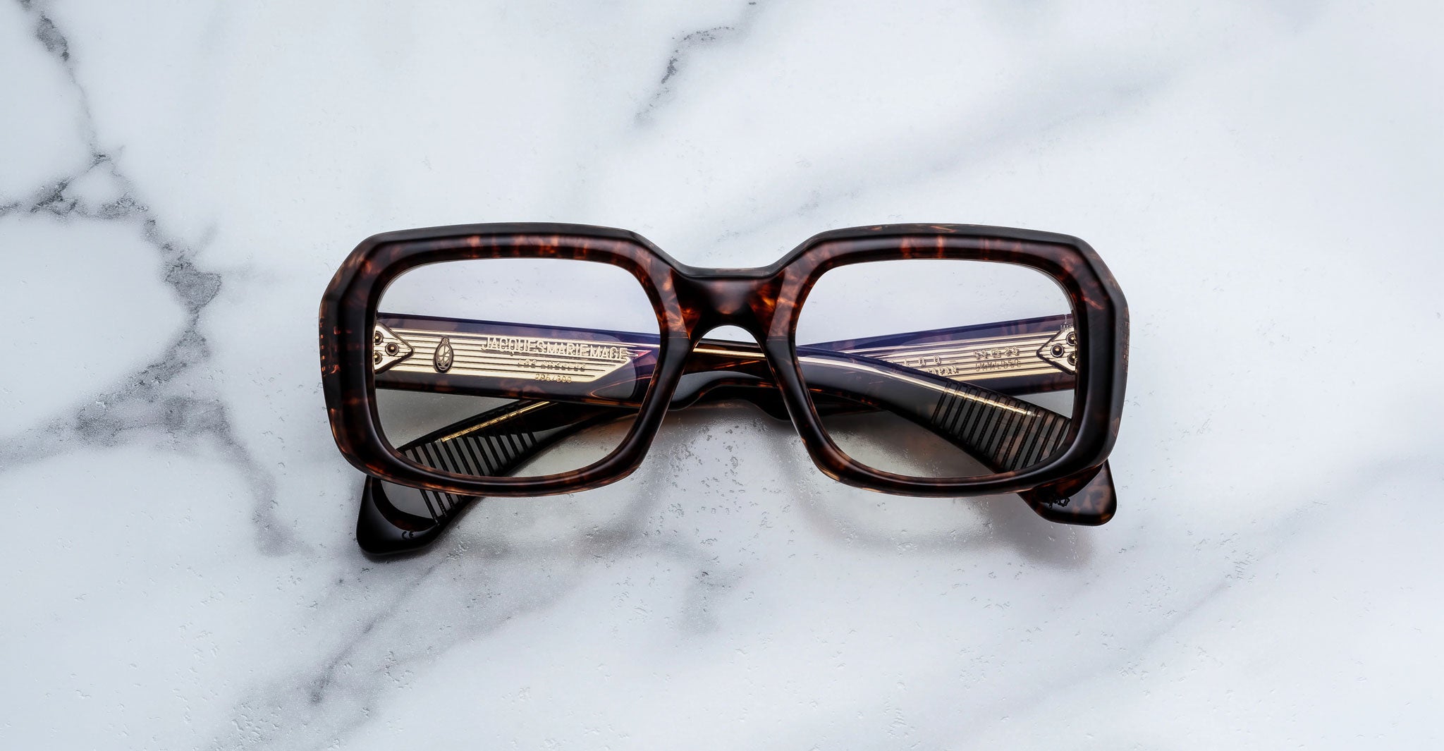 Jacques Marie Mage Aldo square tortoiseshell eyeglasses with gold arms, front view.