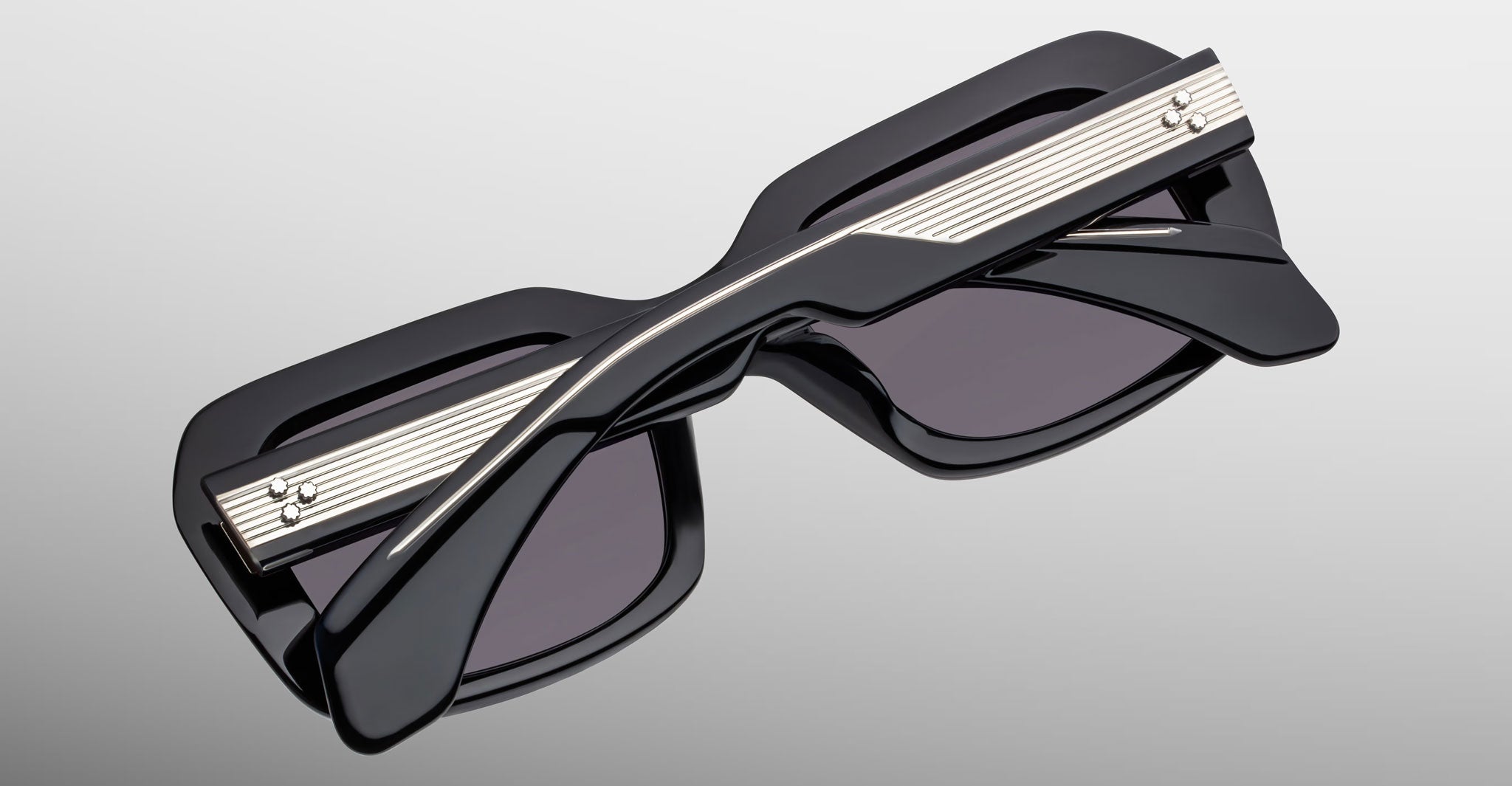 Jacques Marie Mage Aldo sunglasses, black thick rectangular frames with silver accents, front view.
