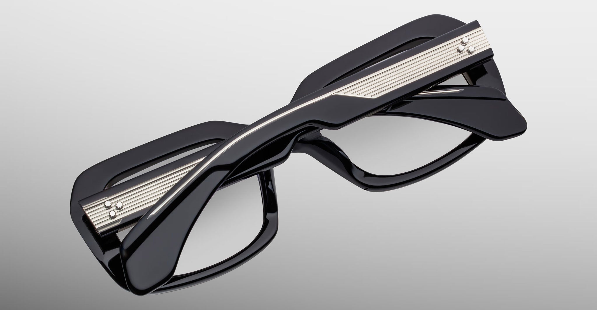 Jacques Marie Mage Aldo eyeglasses, black thick rectangular frames, twisted bridge, metallic temple accents, front view.