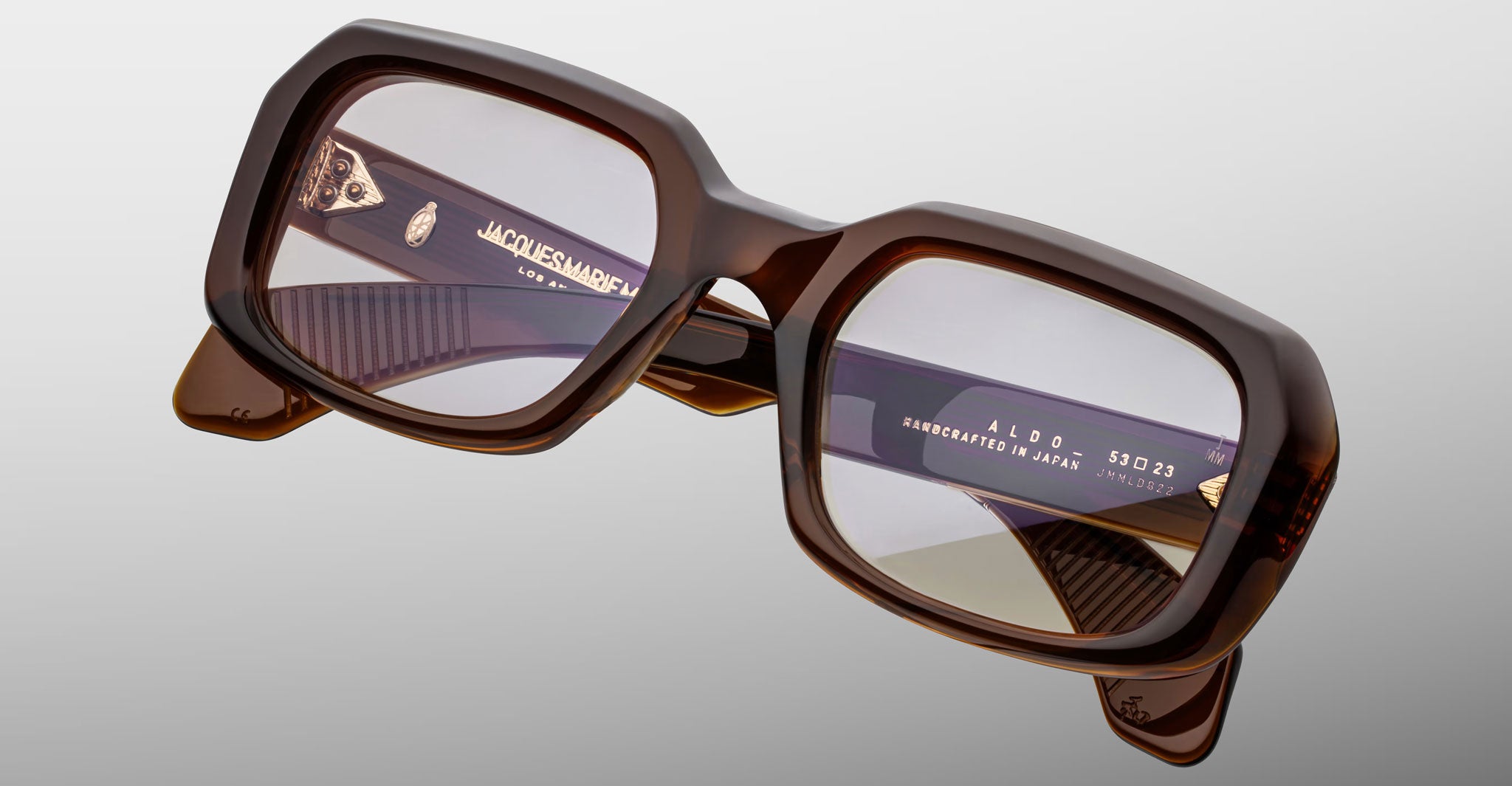 Jacques Marie Mage Aldo brown oversized square eyeglasses with clear lenses, front and side frame details visible.