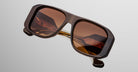 Jacques Marie Mage Alfie sunglasses, bold rectangular shape with thick brown frames and tinted lenses, shown from the front.