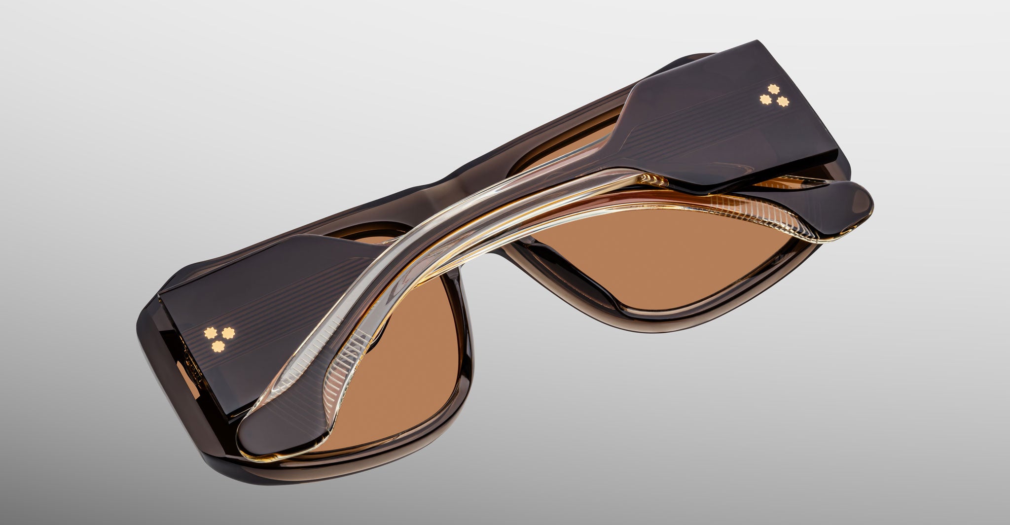 Jacques Marie Mage Alfie sunglasses, folded, thick brown frame with brown-tinted lenses, shown from above.