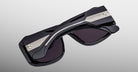 Jacques Marie Mage Alfie black polarized sunglasses with silver arms, side view showing frame and temple details.