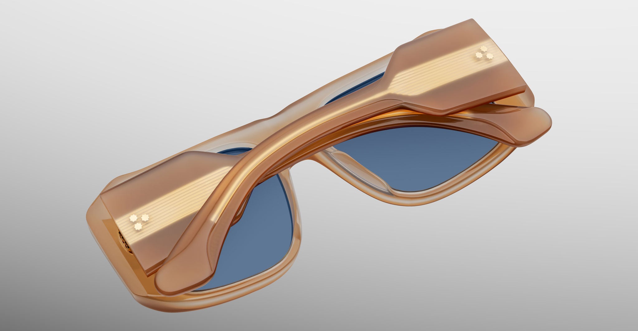 Jacques Marie Mage Alfie sunglasses with tan frames and blue lenses shown from an angled top view.