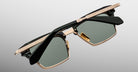 The Jacques Marie Mage Alin sunglasses feature green-tinted rectangular lenses, gold and black frames with a detailed gold top bar, and black arms, displayed against a light gray background.