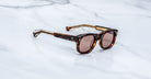 Jacques Marie Mage Amilcar sunglasses with tinted lenses shown from above.