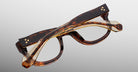 Jacques Marie Mage Amilcar tortoiseshell eyeglasses, folded, side view.