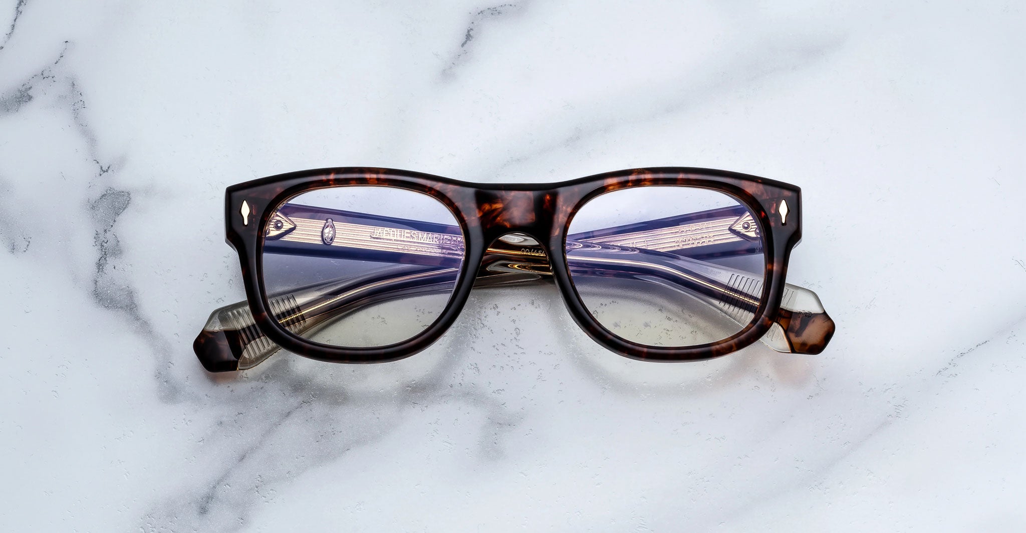 Jacques Marie Mage Amilcar eyeglasses with clear lenses, front view.