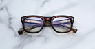 Jacques Marie Mage Amilcar eyeglasses with clear lenses, front view.
