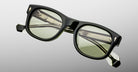 Jacques Marie Mage Amilcar black rectangular eyeglasses with green lenses, front view.