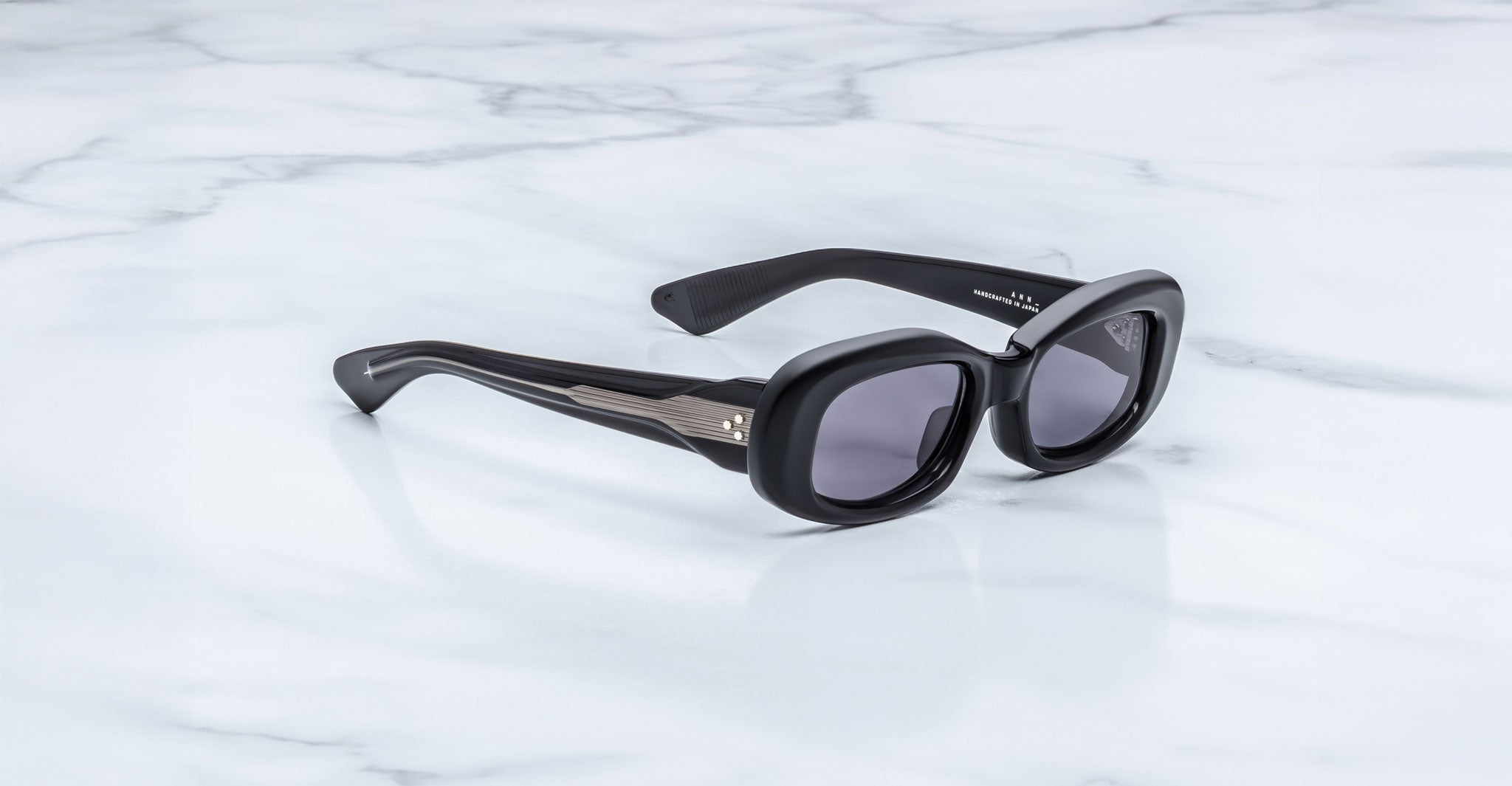 Jacques Marie Mage Ann in Raven black, side angle view highlighting thick temples and engraved wirecore detail