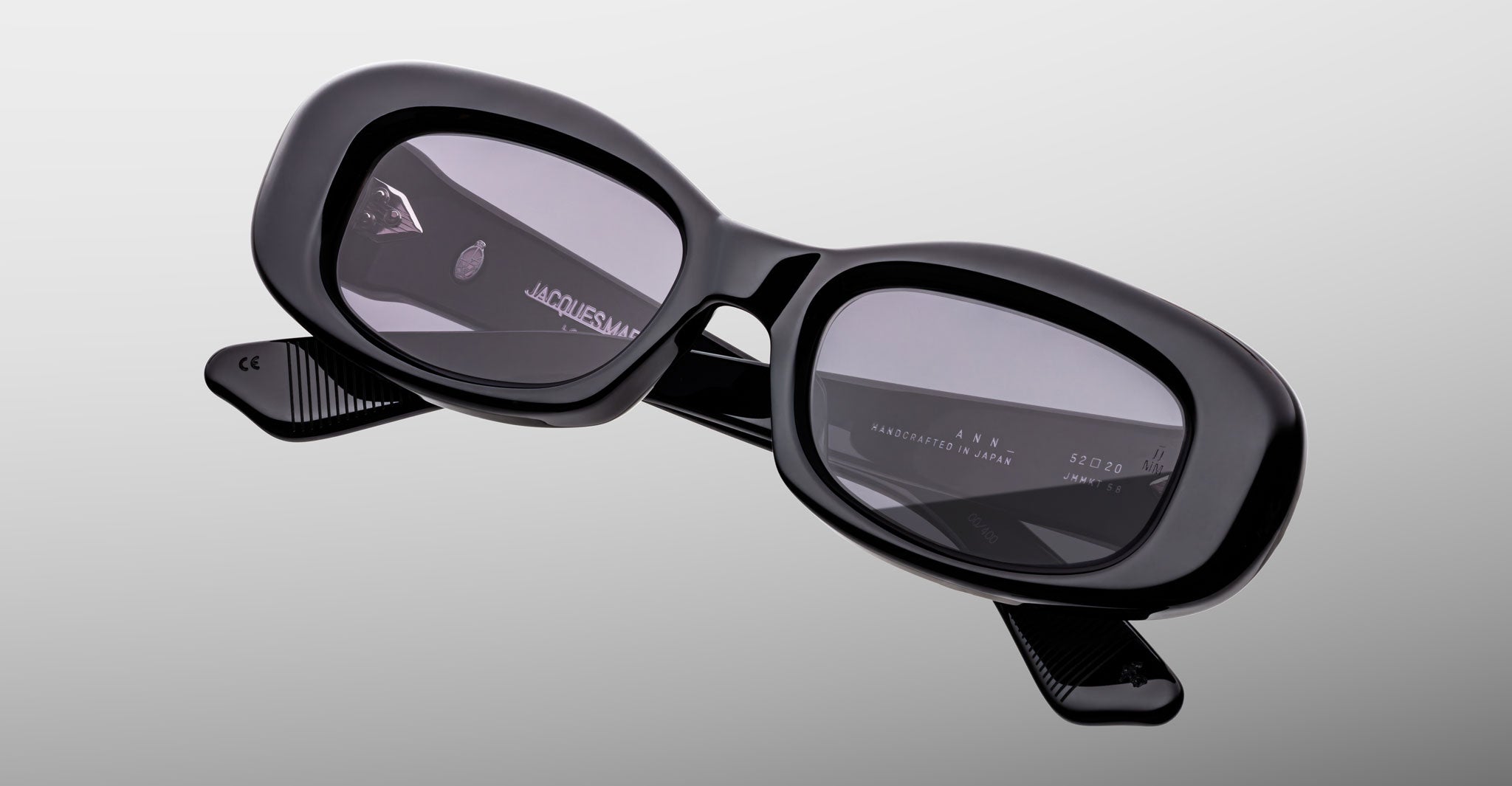Jacques Marie Mage Ann in Raven black, angled front view showing sculptural rectangular frame and thick acetate temples