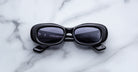 Jacques Marie Mage Ann in Raven black, front view with rectangular lenses and bold sculptural acetate frame