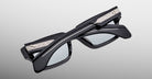 Jacques Marie Mage Ashcroft in Black Mirror acetate featuring a sculptural rectangular frame, exposed wirecore temples with intricate engraving, signature arrowhead front pins, and light grey tinted lenses