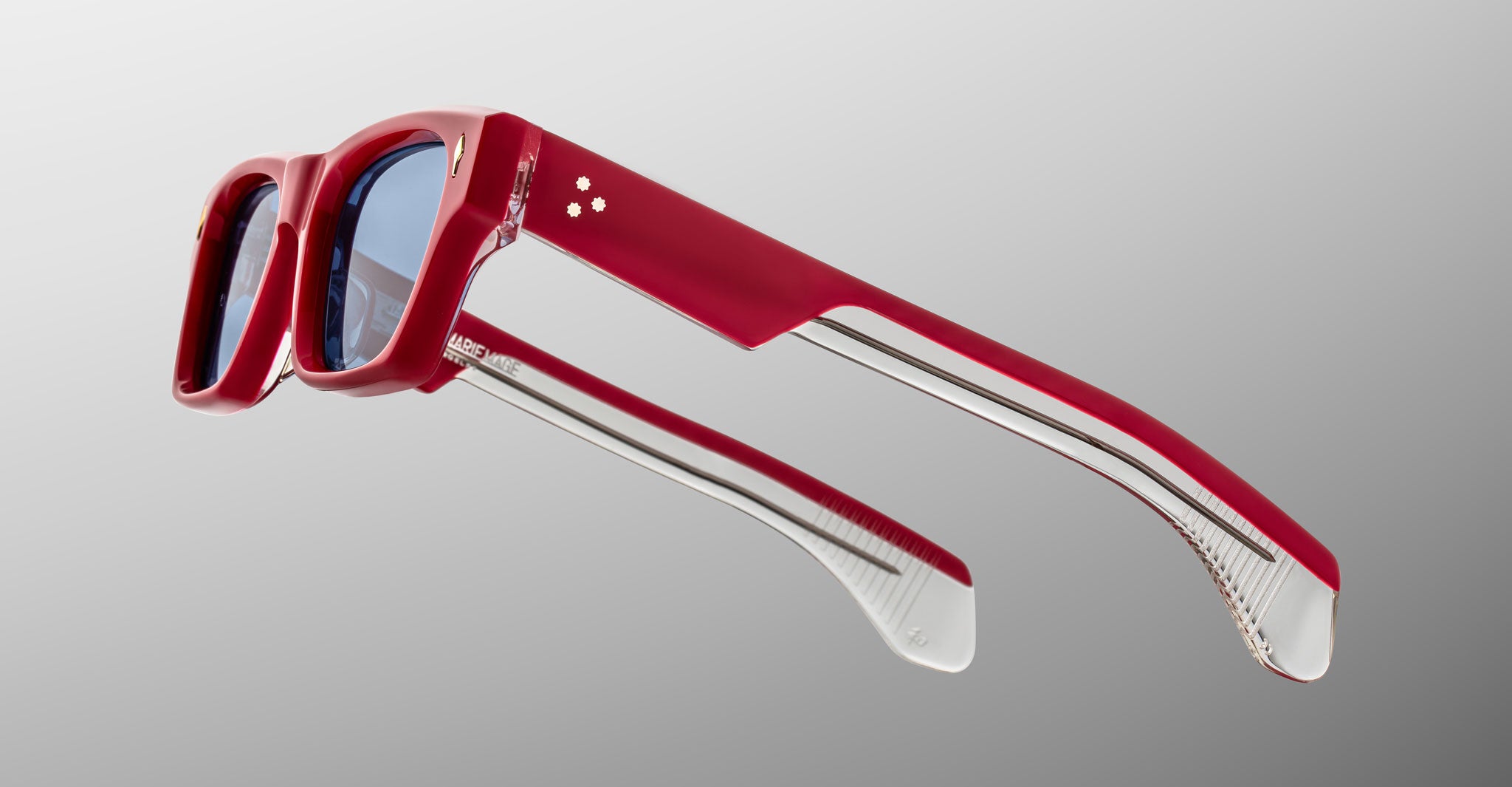 Jacques Marie Mage Ashcroft in Pirate acetate featuring a bold rectangular frame, signature arrowhead front pins, triple dot temple details, exposed wirecore temples, and blue tinted lenses