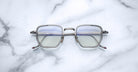 Jacques Marie Mage Atkins square-rimmed eyeglasses with silver frames, top view, showing full front and rim details.