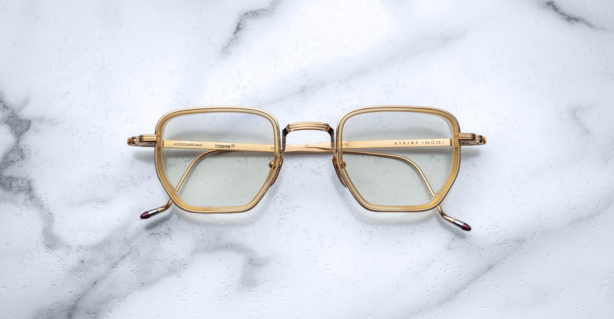 Jacques Marie Mage Atkins square eyeglasses, gold rims, clear lenses, front view.