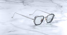 Jacques Marie Mage Atkins silver square eyeglasses with clear lenses, top view.