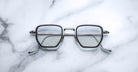 Jacques Marie Mage Atkins eyeglasses, silver frames, clear lenses, front angle view.