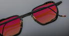 Jacques Marie Mage Atkins black sunglasses with red-orange lenses, front view.