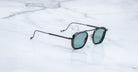 Jacques Marie Mage Baudelaire 2 polarized sunglasses with green lenses shown from above.