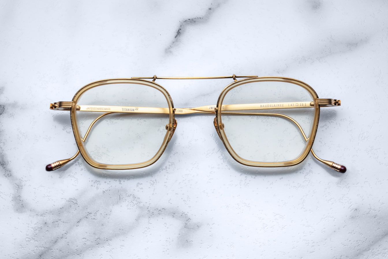 Jacques Marie Mage Baudelaire 2 gold rectangular eyeglasses with clear lenses and double bridge, front view.