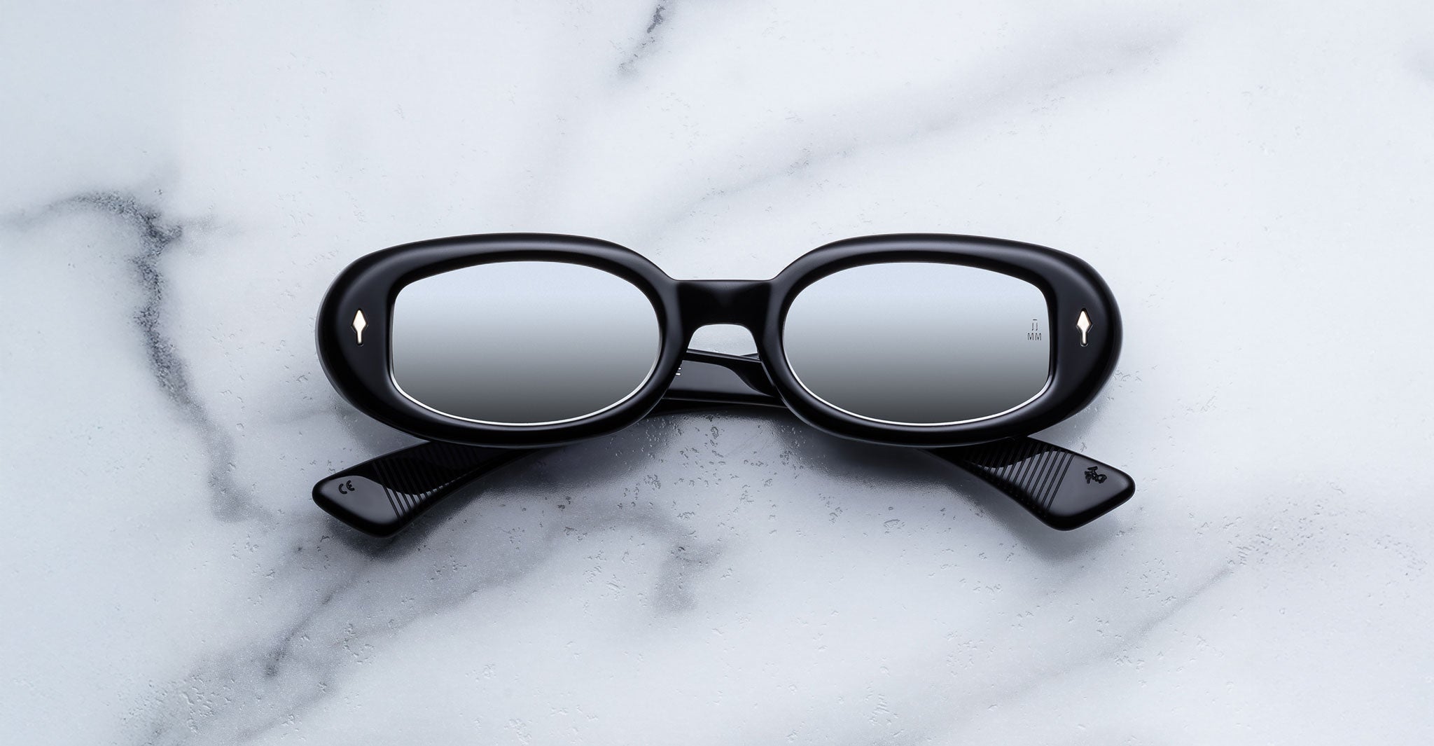 Jacques Marie Mage Besset sunglasses in black with reflective lenses shown front view.