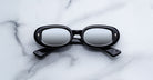 Jacques Marie Mage Besset sunglasses in black with reflective lenses shown front view.